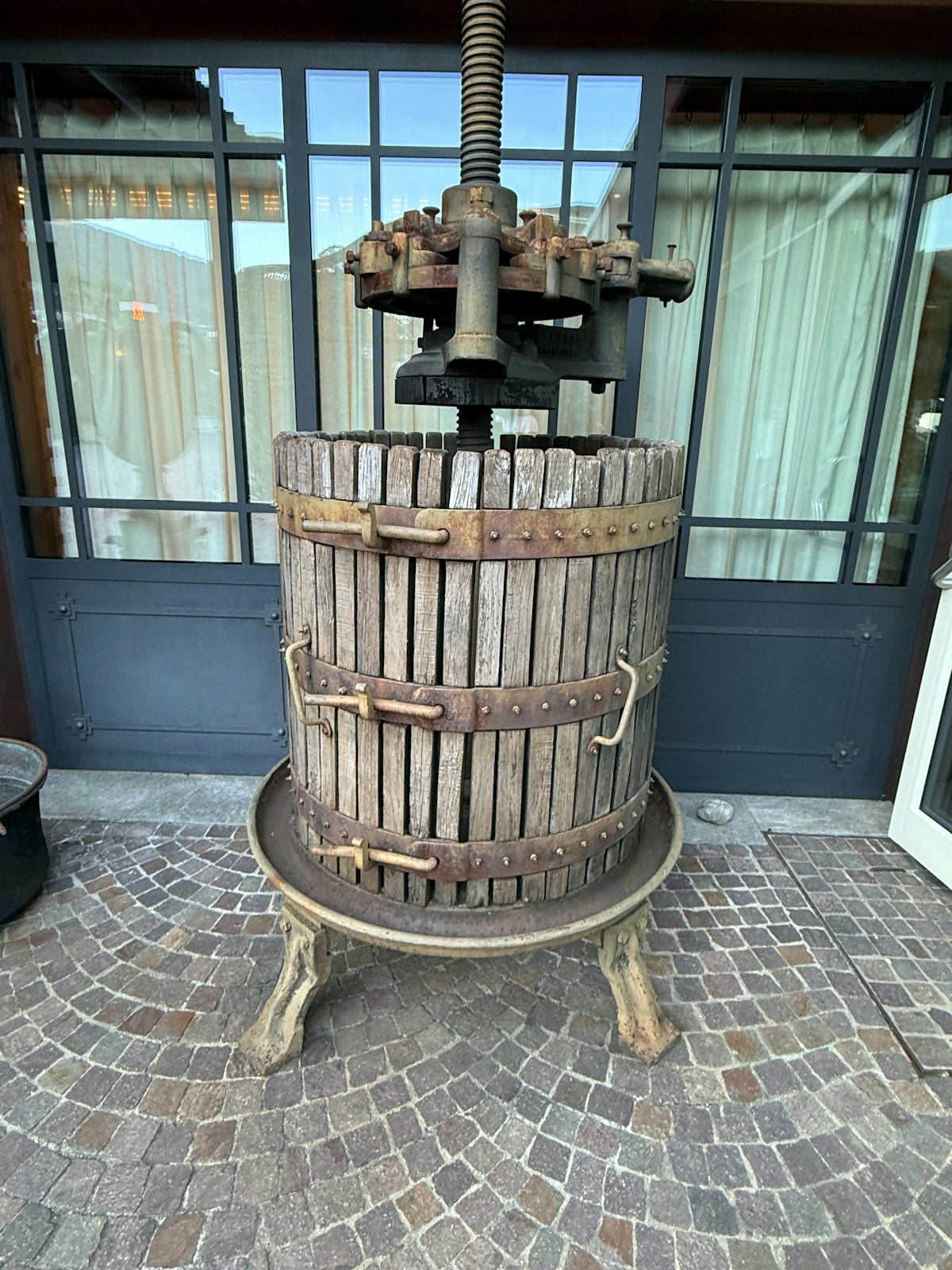 Antique wooden wine press with metal bands