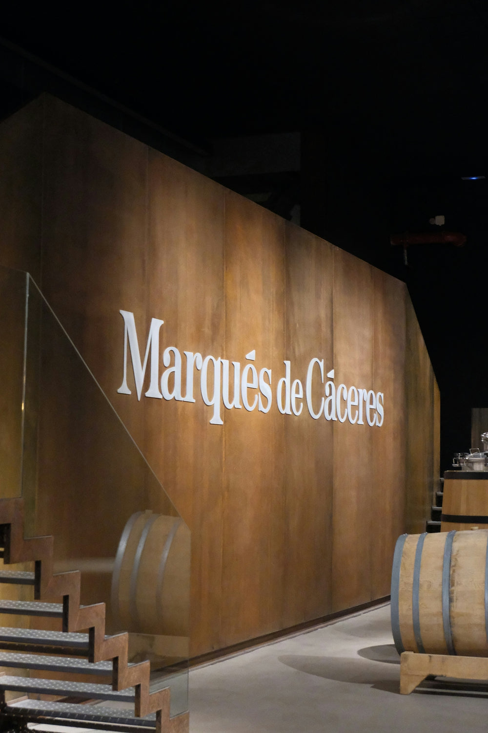 Marqués de cáceres sign with wine barrels